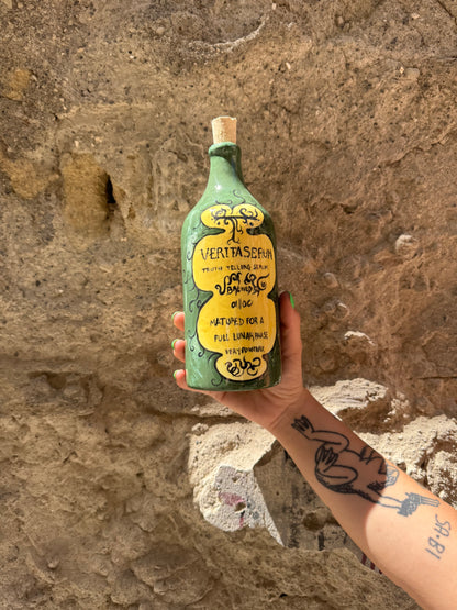 Siero Verita di Oilloc2 in bottiglia con contagocce, con ingredienti naturali per la cura della pelle.